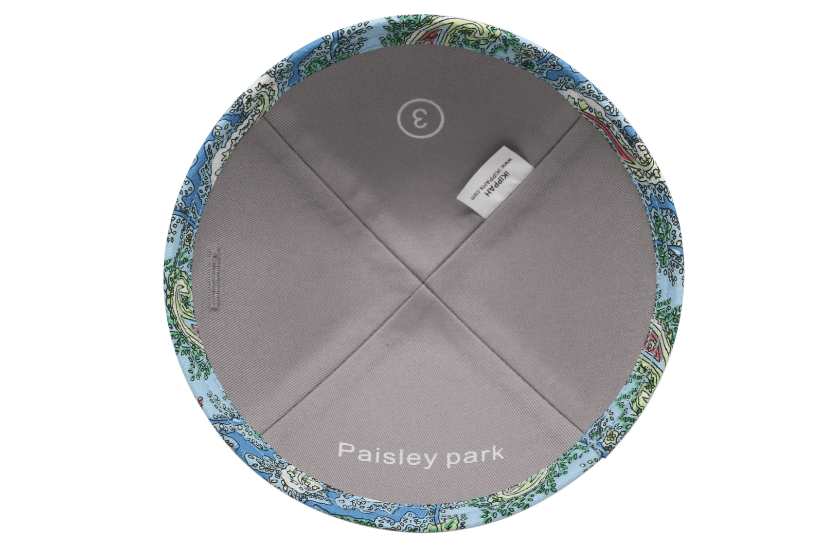 A primarily blue paisley patterned iKIPPAH brand yarmulke inside view.