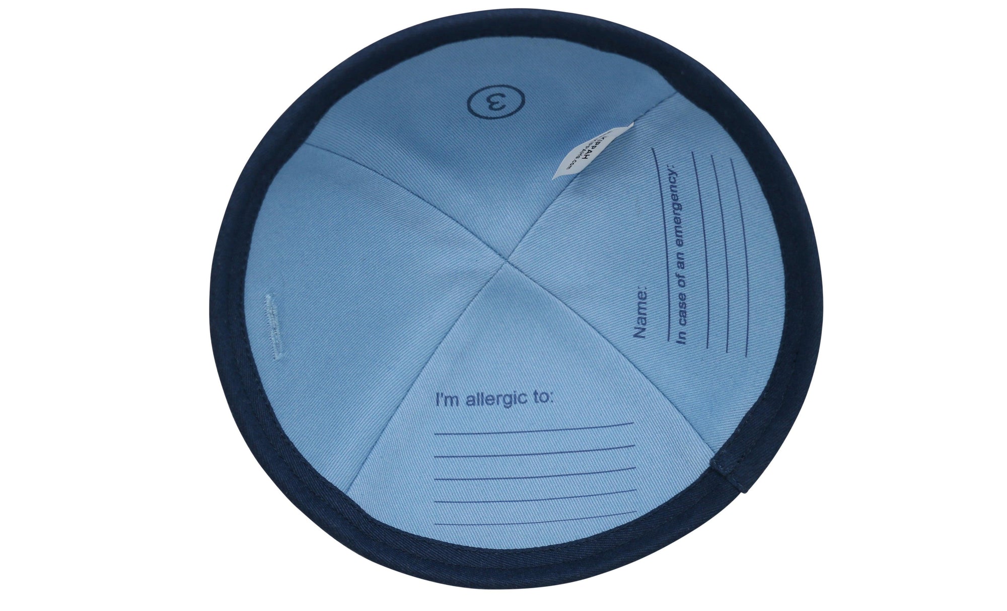 Dark blue iKIPPAH brand yarmulke with an Allergy Alert symbol and a 'flip for info' phrase to help give awareness to people's allegies inside view.