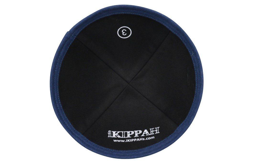 A black linen iKIPPAH brand yarmulke with a navy blue lower rim inside view.