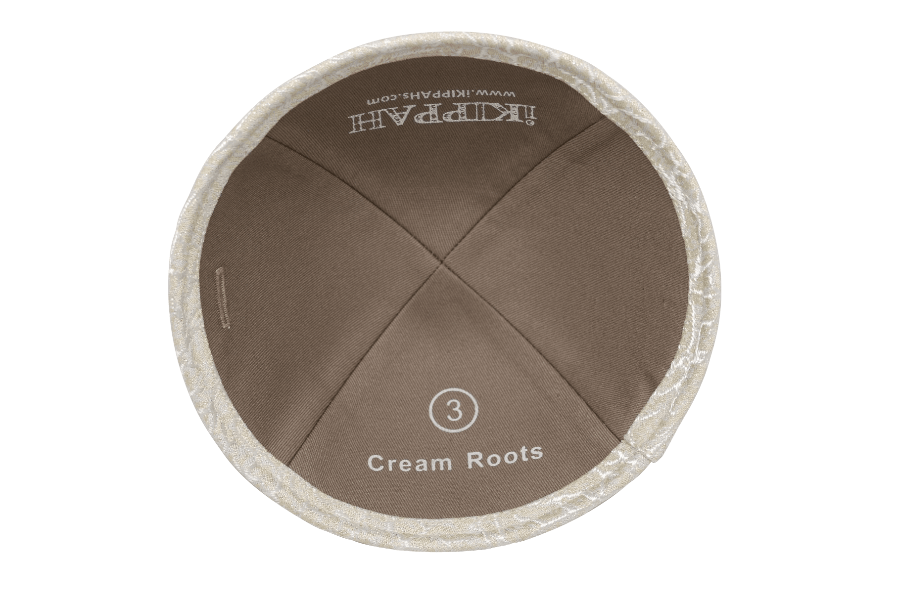 A creme color iKIPPAH brand yarmulke inside view.