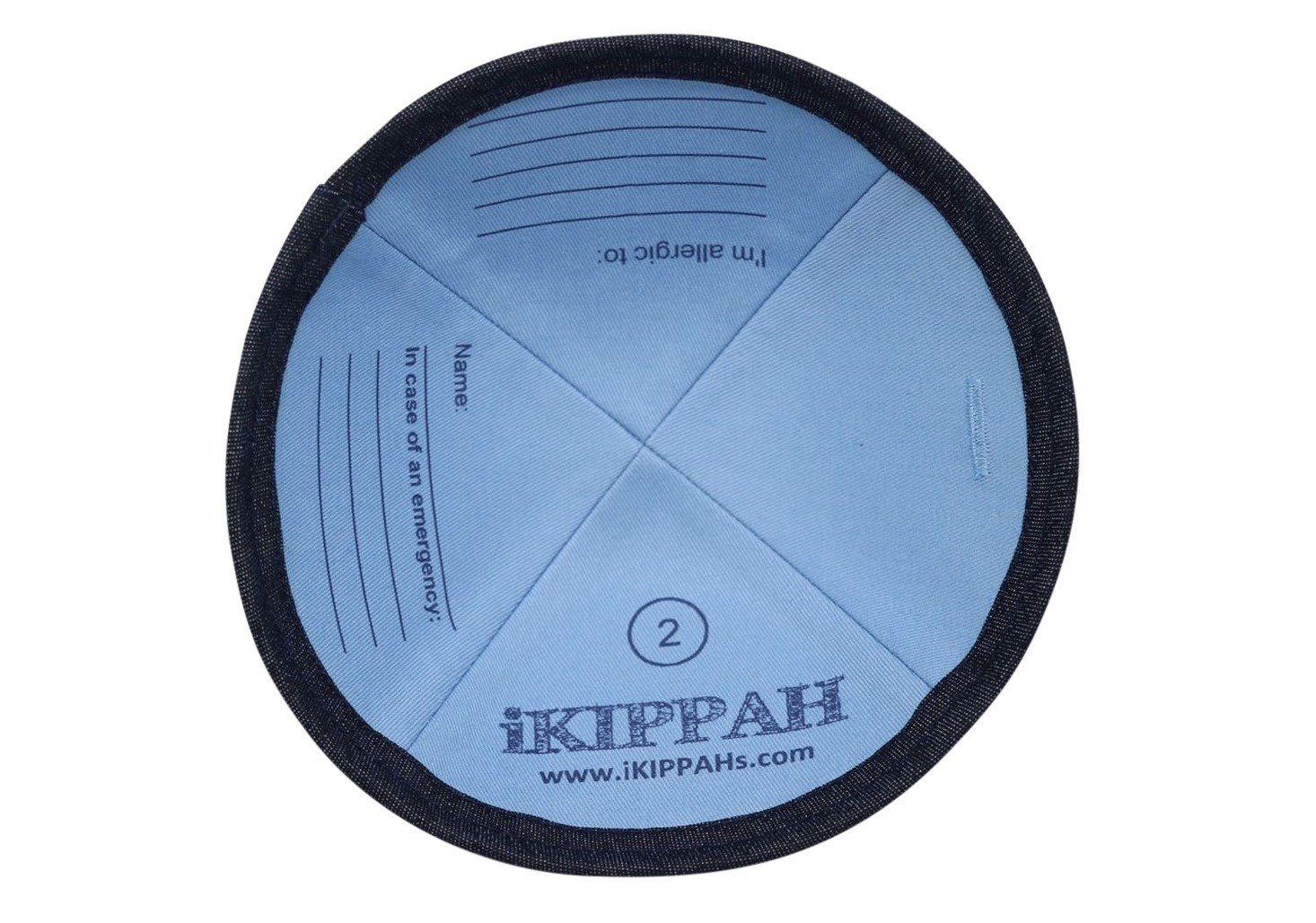 A denim dark blue iKIPPAH brand yarmulke with an Allergy Alert symbol and a 'flip for info' phrase to help give awareness to people's allegies inside view.