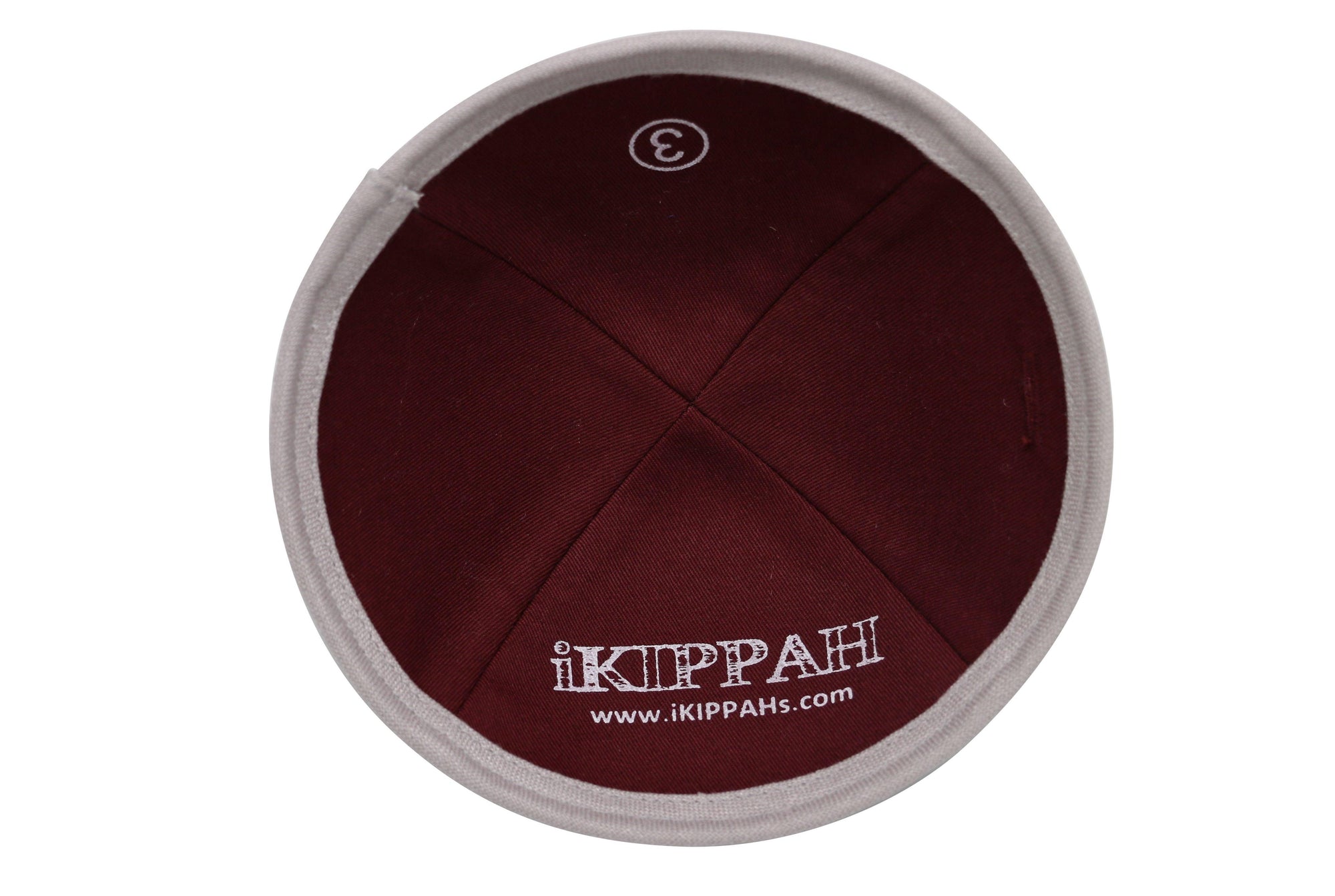 A light gray burlap iKIPPAH brand yarmulke inside view.