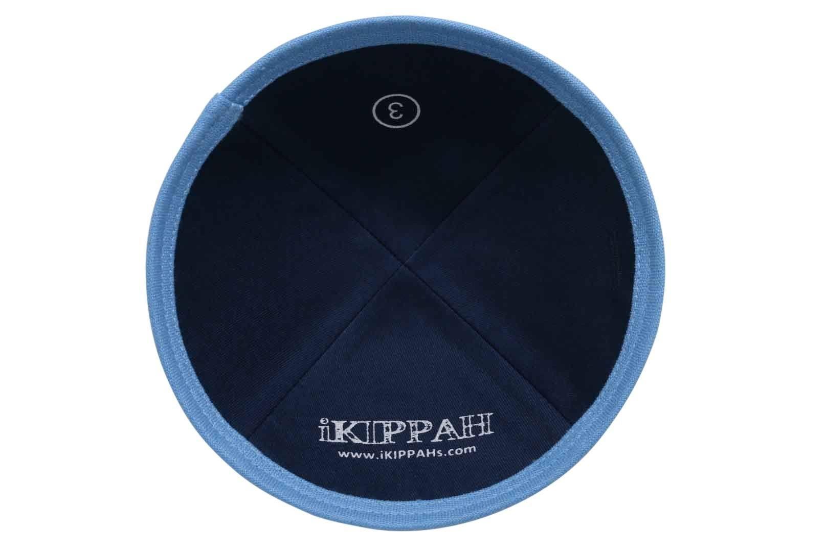 A navy blue iKIPPAH brand yarmulke with a light blue bottom trim rim inside view.