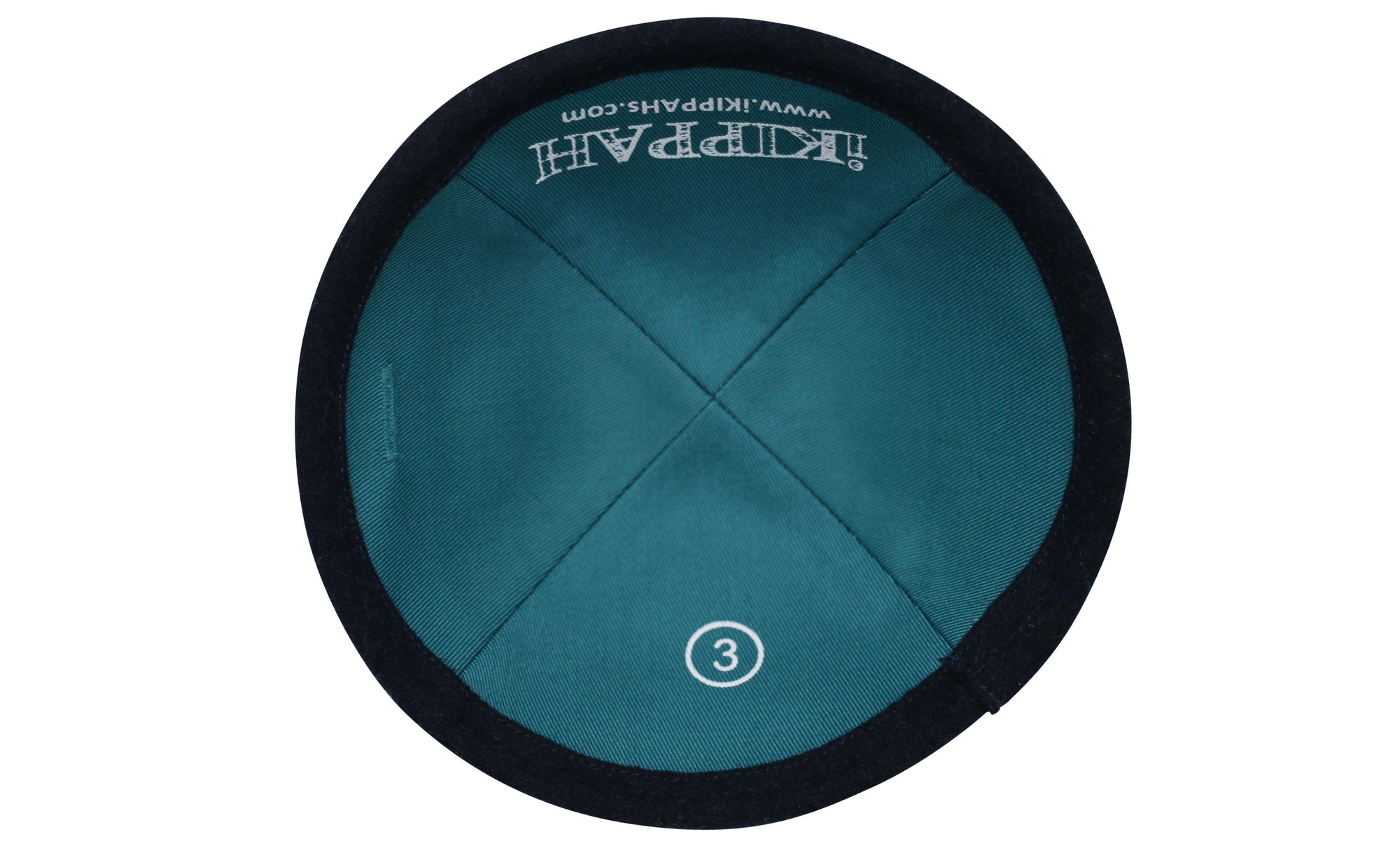 A rich navy blue iKIPPAH brand yarmulke inside view.