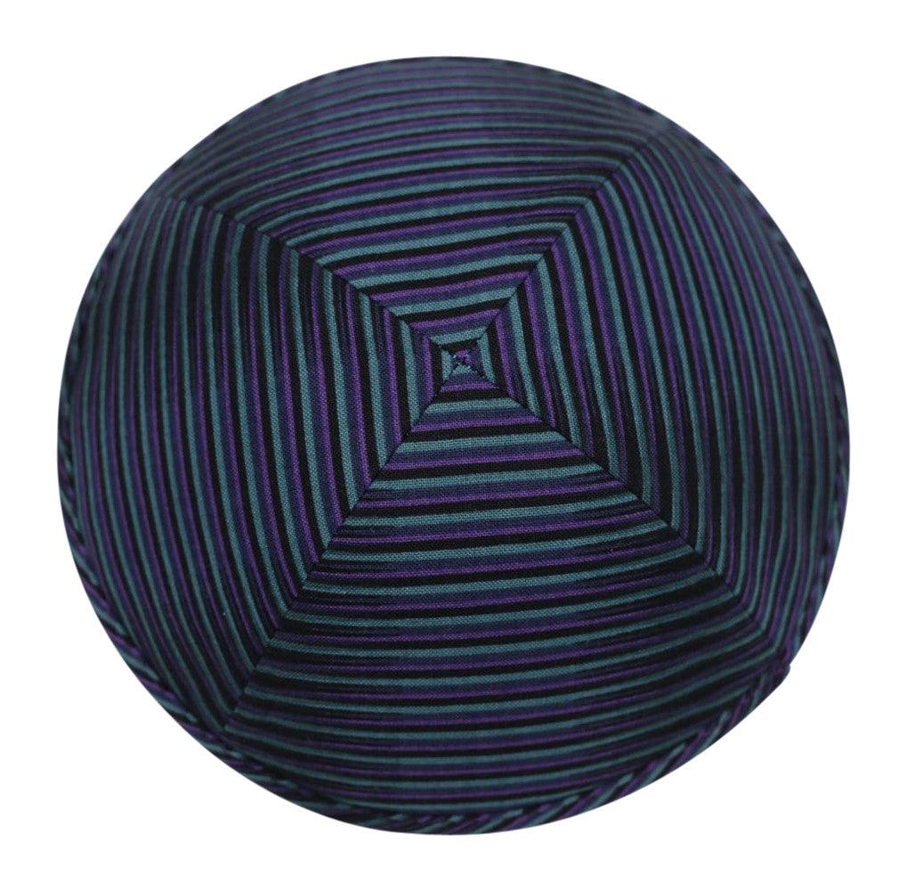 An iKIPPAH brand yarmulke with a design that resembles the classic pull n peel licorice candy in blue and purple - top view.