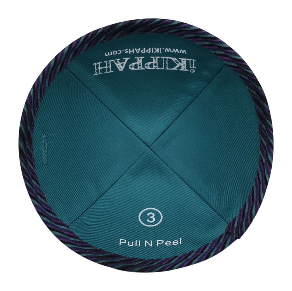 An iKIPPAH brand yarmulke with a design that resembles the classic pull n peel licorice candy in blue and purple - inside view with label.