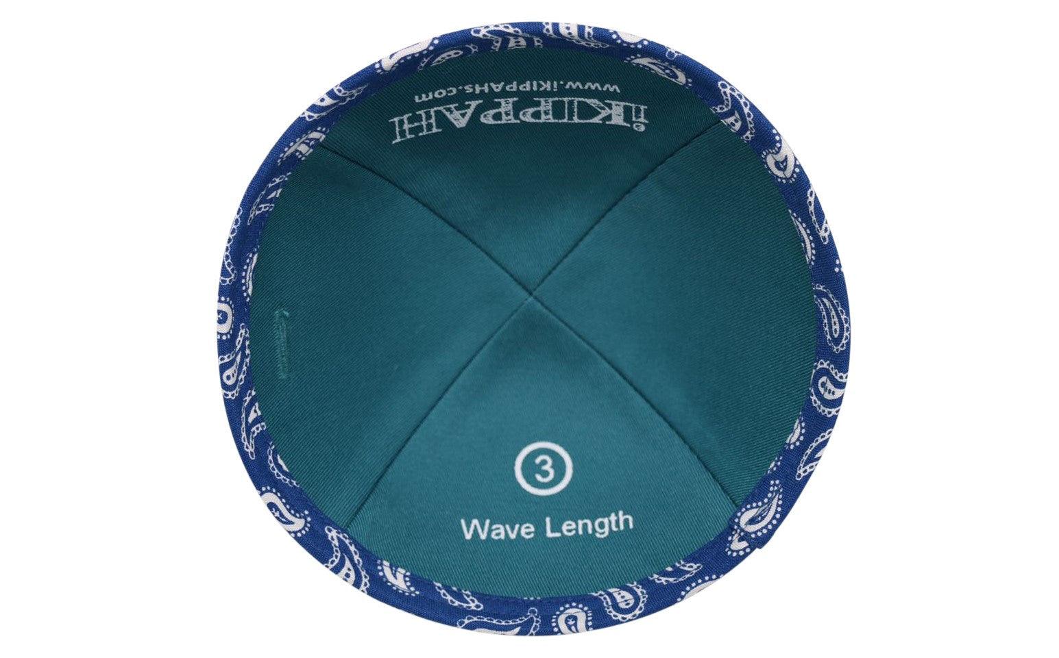 A Blue iKIPPAH brand yarmulke with little wavelengths on it inside view.